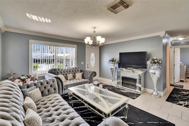 tiled living room with a textured ceiling, crown molding, visible vents, baseboards, and an inviting chandelier