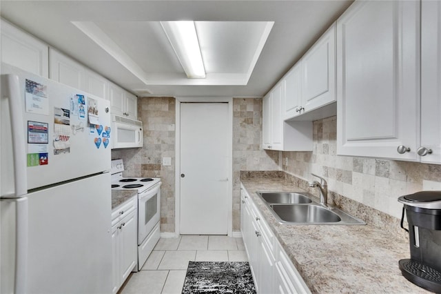 kitchen with light tile patterned flooring, white appliances, a sink, white cabinetry, and light countertops