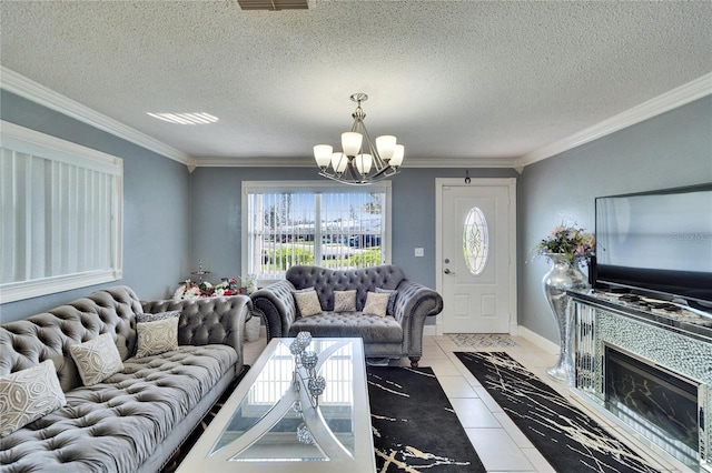 living room with crown molding, a notable chandelier, light tile patterned flooring, a textured ceiling, and baseboards