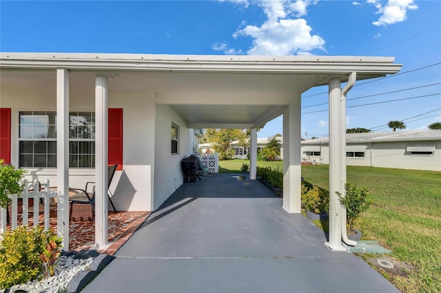 view of parking / parking lot with an attached carport