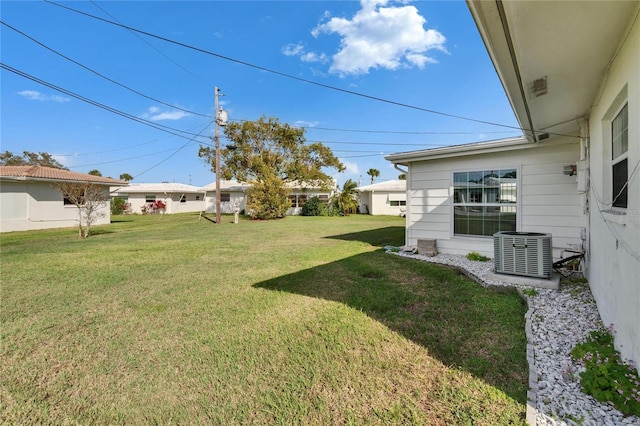 view of yard featuring central AC unit