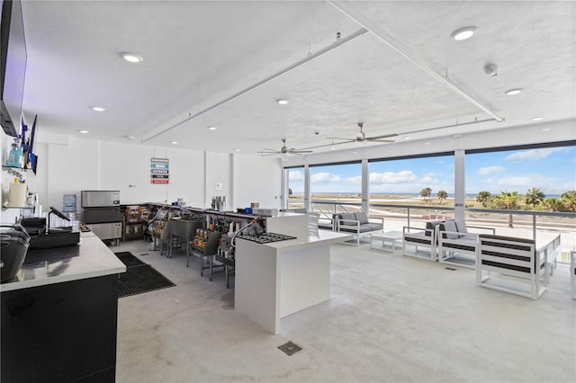 home office with concrete flooring and recessed lighting