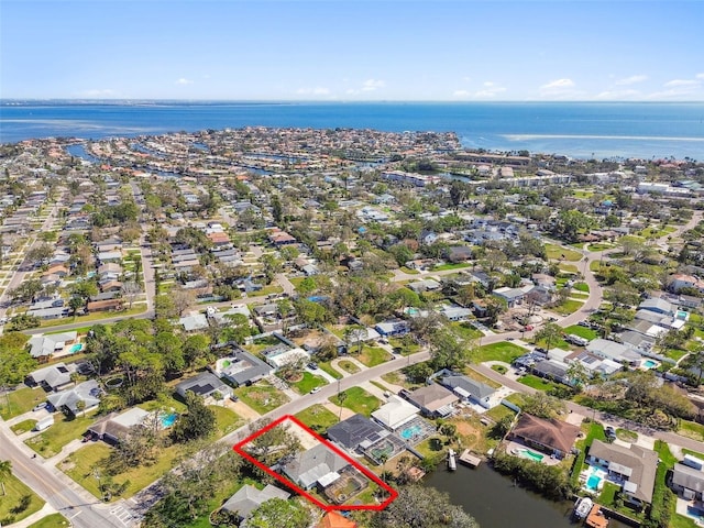 bird's eye view with a residential view and a water view