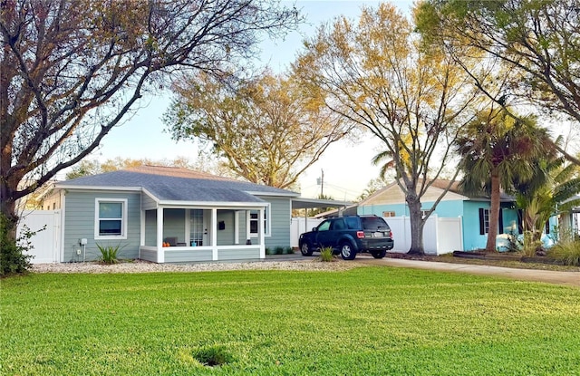 single story home featuring fence and a front yard