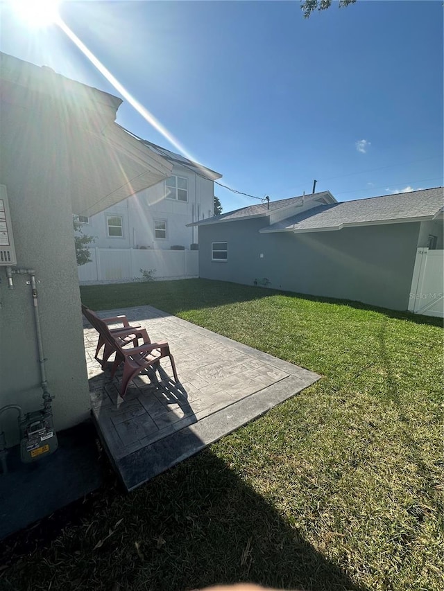 view of yard with a patio area and fence