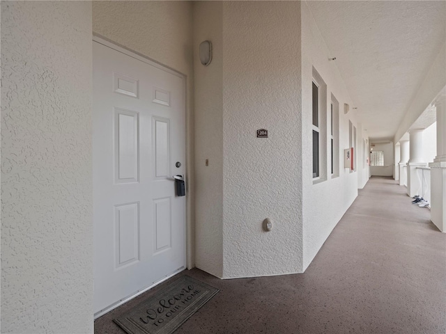 doorway to property with stucco siding