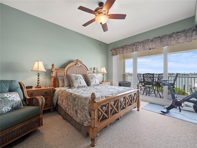 carpeted bedroom featuring access to outside and ceiling fan