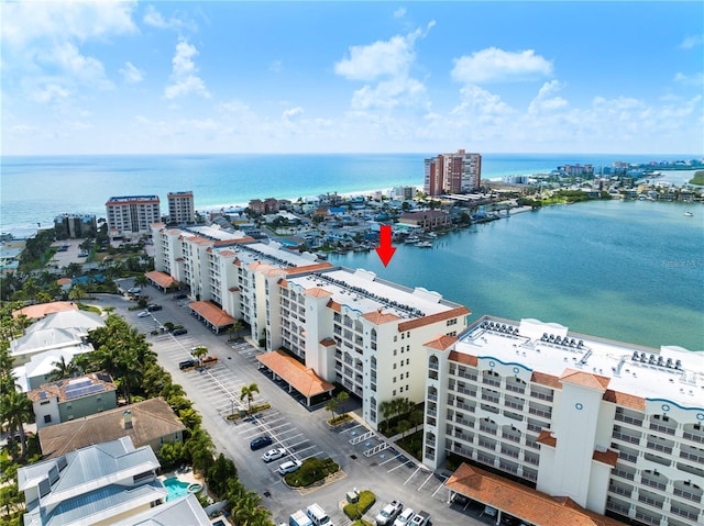 birds eye view of property featuring a view of city and a water view