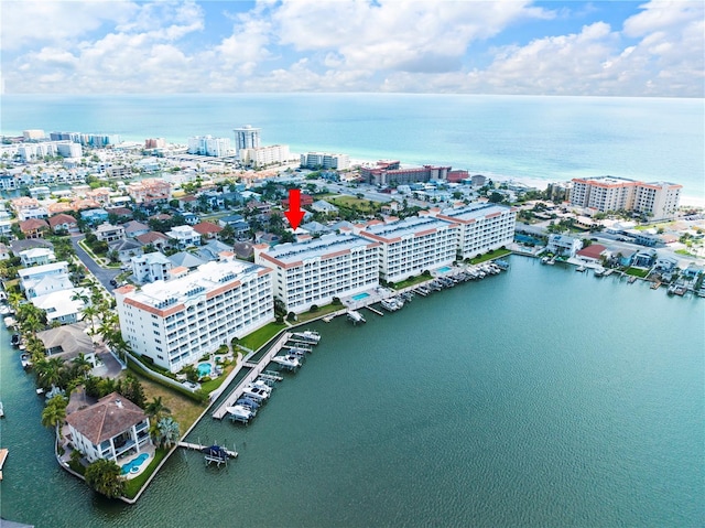 birds eye view of property with a view of city and a water view