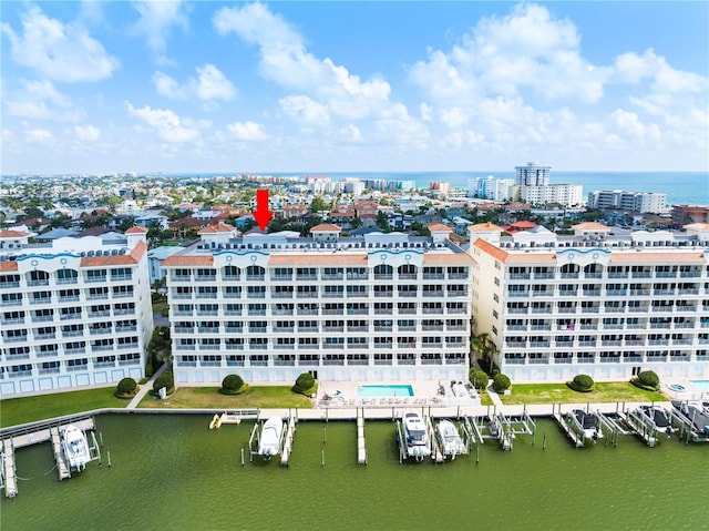 bird's eye view featuring a water view and a view of city