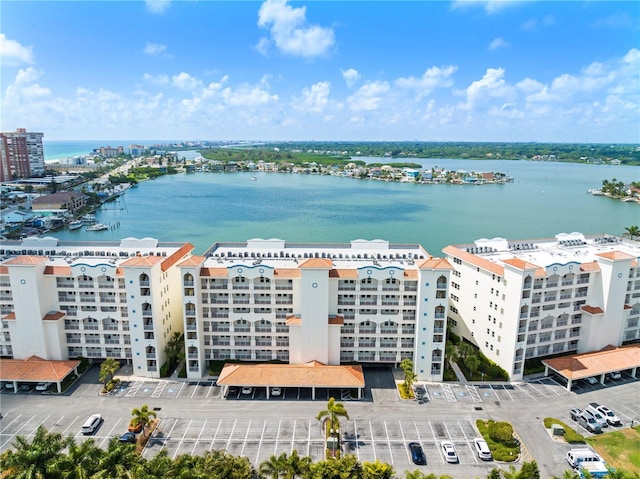 birds eye view of property with a water view and a city view