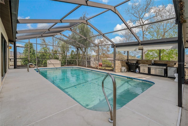 outdoor pool featuring exterior kitchen, a patio area, and a lanai