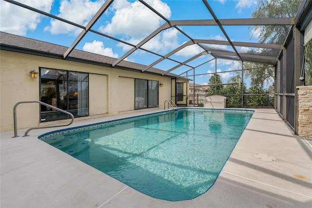 pool with glass enclosure, a shed, and a patio