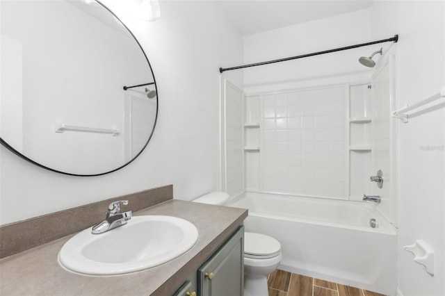 full bath featuring shower / washtub combination, vanity, toilet, and wood finished floors