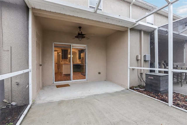 view of patio with ceiling fan and central AC