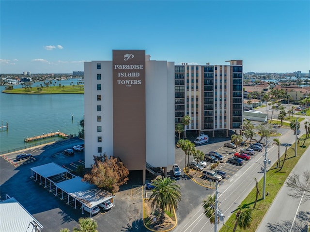 view of property featuring a water view and a city view