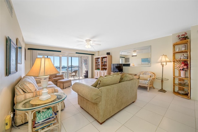 living room featuring a ceiling fan, light tile patterned flooring, and visible vents