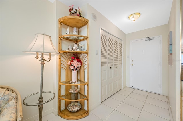 foyer featuring light tile patterned flooring