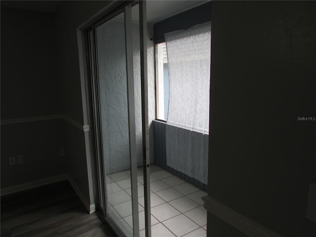 interior space featuring a healthy amount of sunlight and tile patterned floors