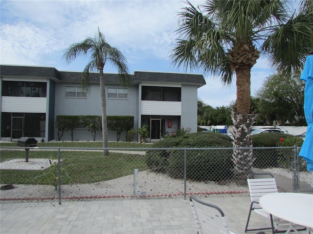 view of building exterior with fence