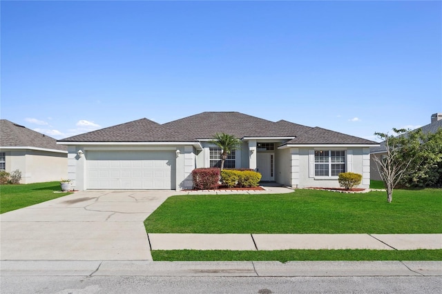 single story home featuring a garage, a front yard, driveway, and stucco siding