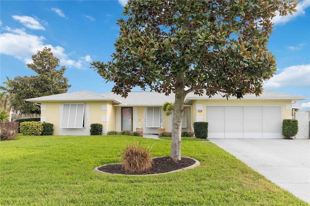 ranch-style house with a garage, a front yard, driveway, and stucco siding