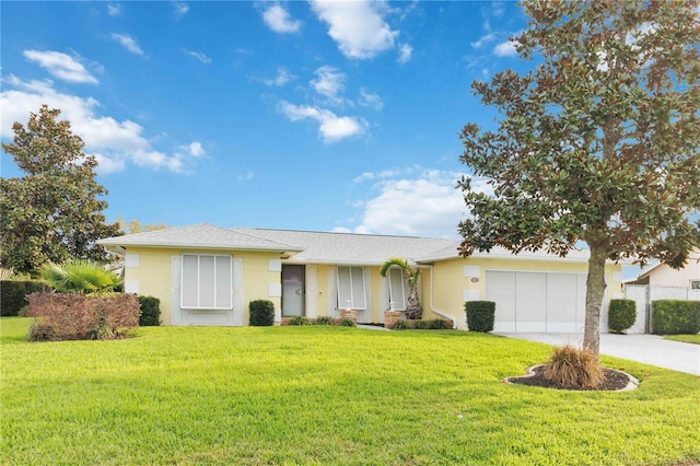 ranch-style house with a garage, driveway, a front lawn, and stucco siding