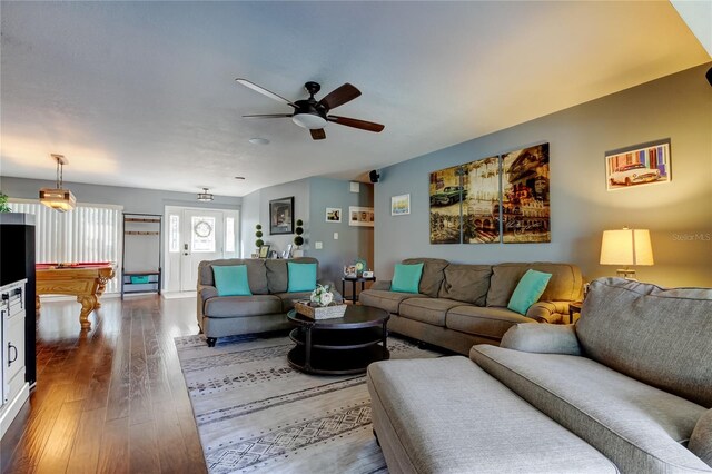 living room featuring ceiling fan and wood finished floors