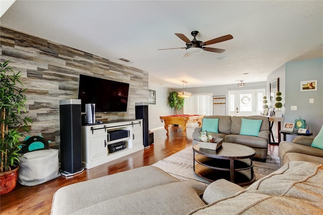 living area featuring visible vents, an accent wall, dark wood-type flooring, a ceiling fan, and billiards