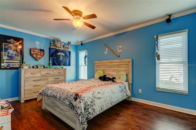 bedroom featuring baseboards, dark wood-type flooring, a ceiling fan, and crown molding