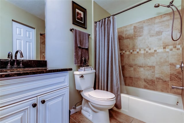 full bathroom featuring toilet, shower / bath combo, vanity, and tile patterned floors