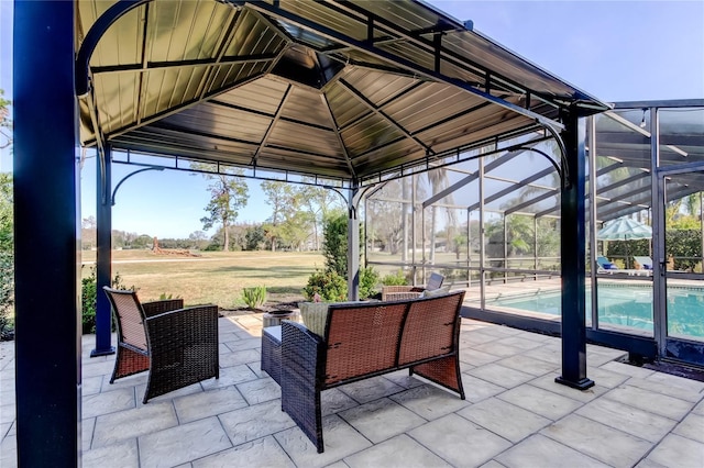 view of patio / terrace with glass enclosure, a gazebo, and an outdoor pool