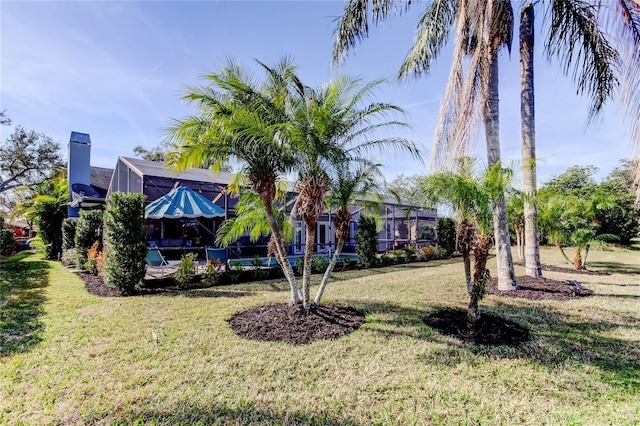 view of yard featuring a lanai