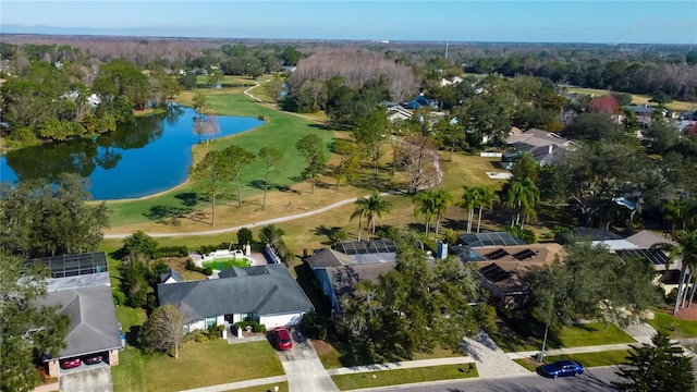 drone / aerial view featuring a water view and a residential view