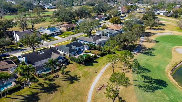 drone / aerial view featuring a residential view and golf course view