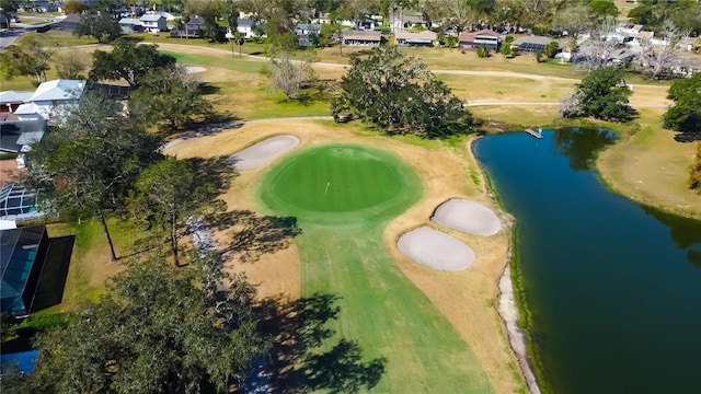 drone / aerial view featuring a water view, a residential view, and golf course view