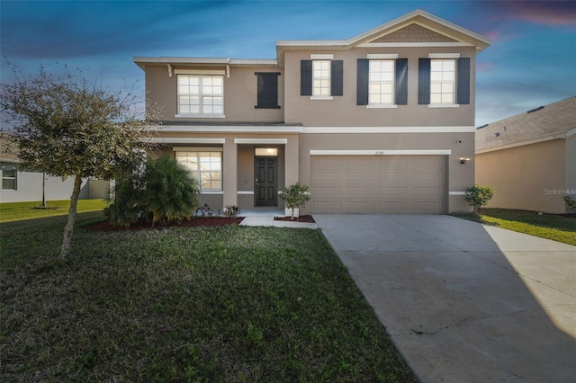 traditional-style house with an attached garage, covered porch, driveway, stucco siding, and a front yard