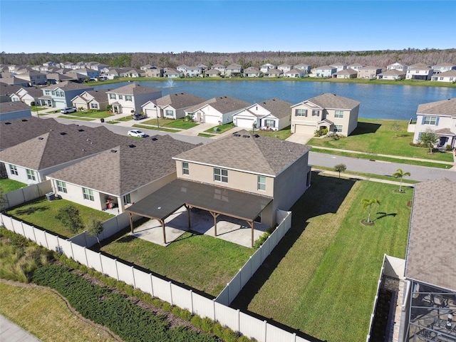 birds eye view of property featuring a residential view and a water view