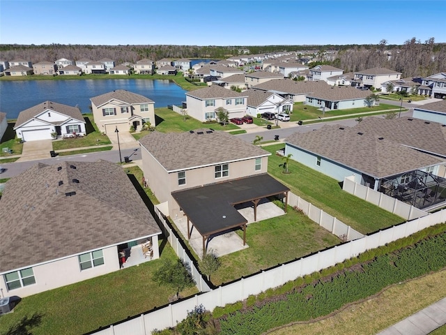 bird's eye view with a water view and a residential view