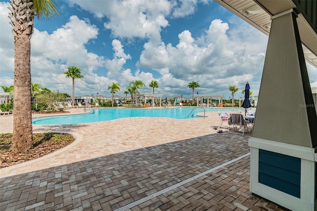 community pool with a patio