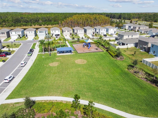 birds eye view of property with a forest view and a residential view