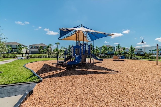 community jungle gym with a residential view