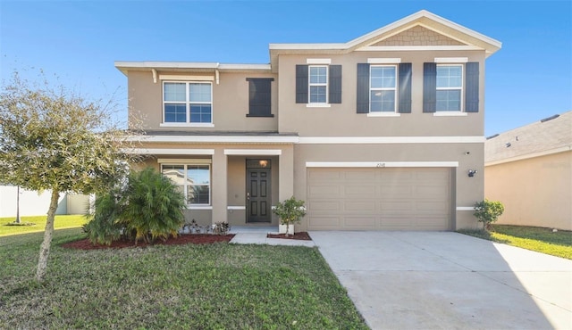 view of front of house with a front yard, driveway, an attached garage, and stucco siding