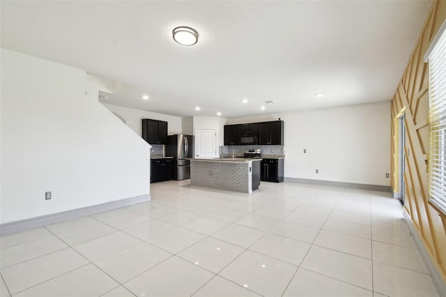 unfurnished living room featuring light tile patterned floors, baseboards, and recessed lighting