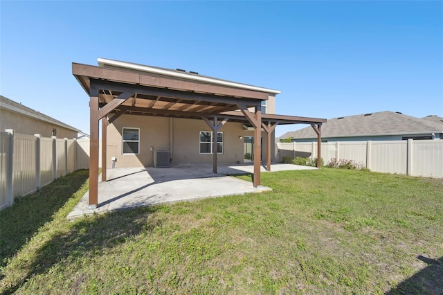 back of property featuring stucco siding, a fenced backyard, a patio, and a yard