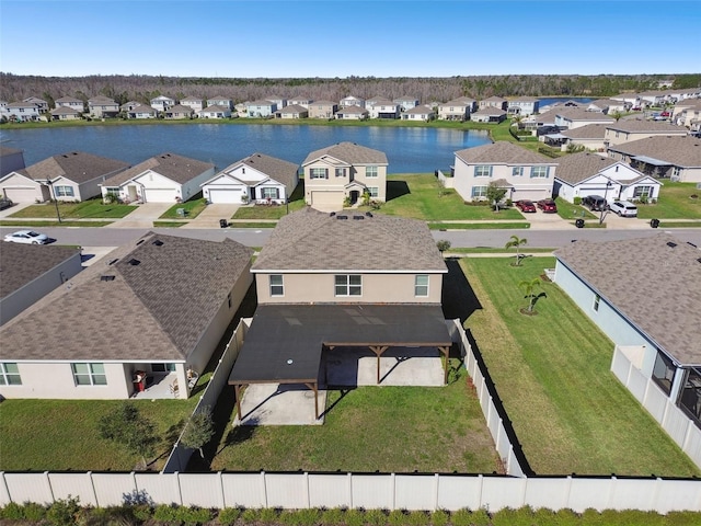 bird's eye view featuring a water view and a residential view