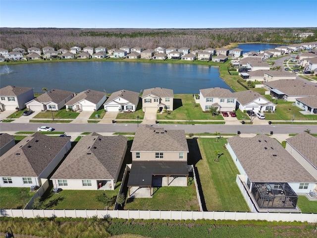 aerial view featuring a water view and a residential view