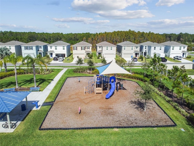 communal playground with a residential view and a lawn