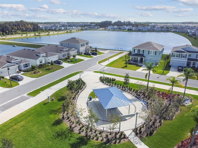 bird's eye view featuring a water view and a residential view