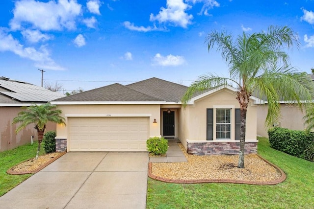 single story home with a garage, stone siding, driveway, and stucco siding